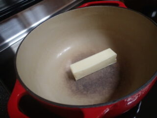 cheddar broccoli soup Dutch oven and butter